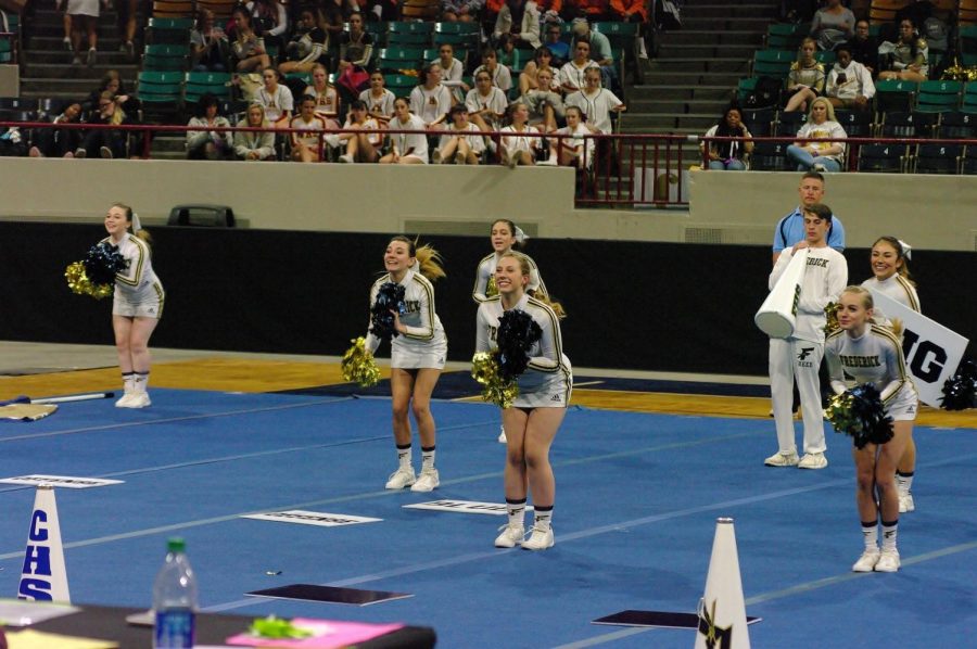 Madison Hardy, Zoe Clawson, Isabella Zeiler, Nevaeh Rifle, Oskar Koepf, Kaelynn Villalobos and Kiley Ostler on the floor at competition performing with all theyve got. 