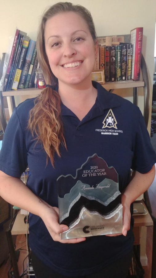 After a long wait time to actually get the physical award in her hand, Amanda Fitzgerald gives a proud smile to show off her amazing accomplishment.