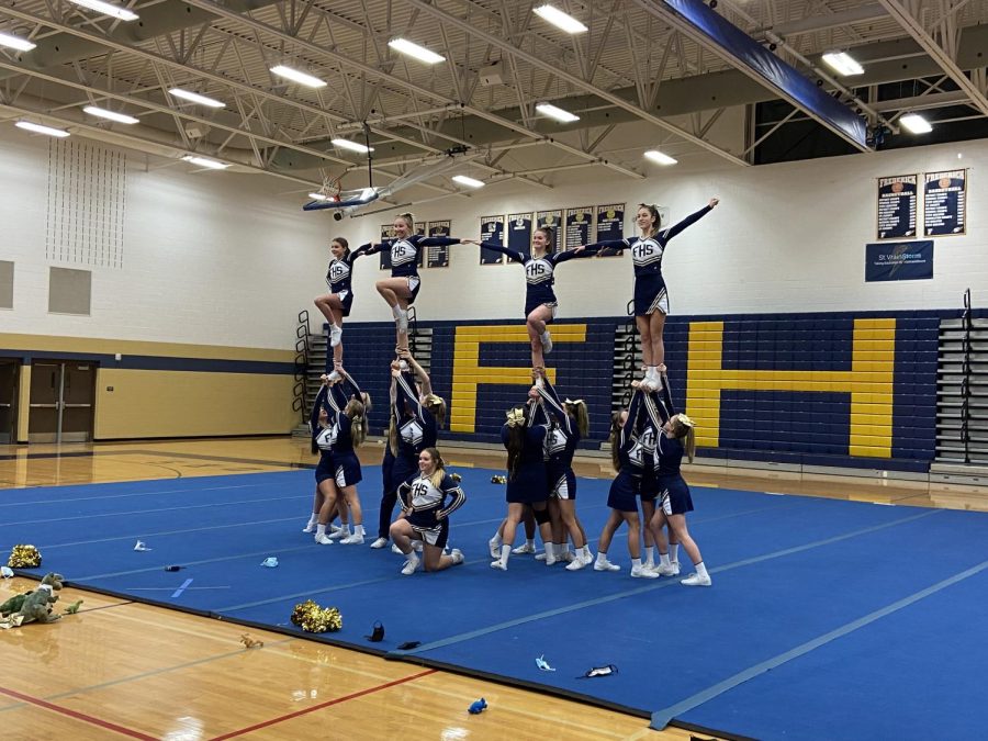 The cheerleading team practices formation on Wednesday, December 8th. It’s the teams’ final practice before heading to the state competition this weekend.
