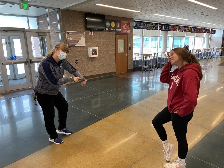 Mrs. Jennifer Santos, Assistant Principal at Frederick High, scolds senior Jillian Margheim for being late to class. Starting on January 10, any underclassman who gets marked tardy 20 times or more will lose the ability to have off-blocks in the 2022-2023 school year, and any upperclassman who gets more than 20 tardies will lose the ability to attend Prom in April. “[Being tardy really] takes away from instructional time [especially] for students [who] come in 15 minutes late, [because those students end up] missing the whole setup [and introduction to class] and, ultimately, [being late] does impact your grade, says Ms. Swanson.