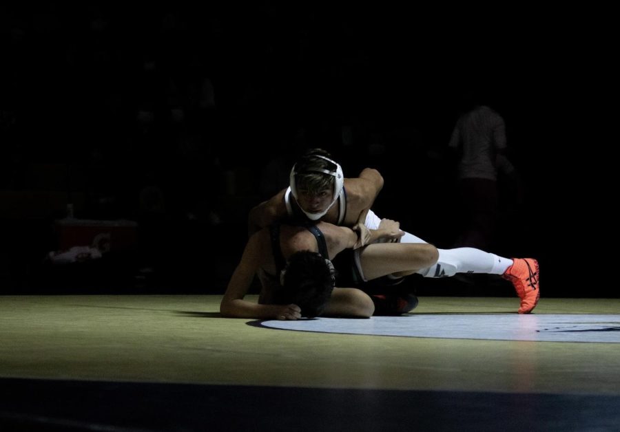 Alex Carrillo going for the pin on his opponent during a home duel. Alex explains, “What makes me really enjoy wrestling is it’s just me and my opponent, no one can help me and I have to rely on myself to win. What really made me love the sport though was making state my sophomore year, then placing 4th at the state tournament my junior year, and making first team all conference my junior year, it really made me driven to win. I also like the team chemistry we have compared to other teams, it’s very unique.”
