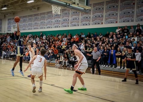 Harry Singh hoists up a shot during the second half against the Mead Mavericks. Singh had 6 points on the night.