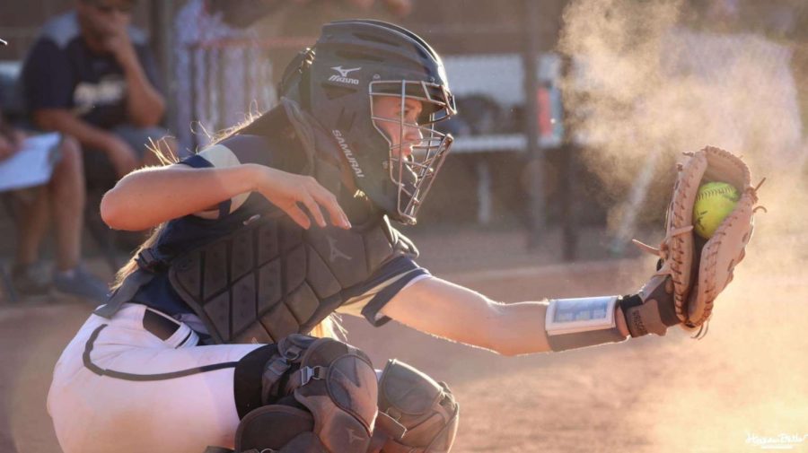 Bella Hewitt framing a pitch behind the plate her Senior Year.