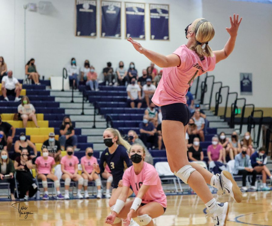 Kinley Lindhardt, one of the best outside hitters in the history of FHS, rises up for a kill during one of her matches