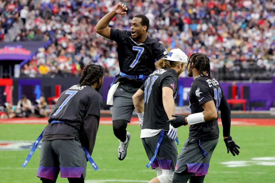 Quarterback Geno Smith and the NFC celebrating their win in the first flag football game.
