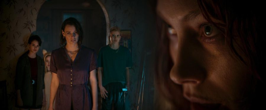 Ellie and her family as they start to become worried about her. Photo credits: Warner Bros.