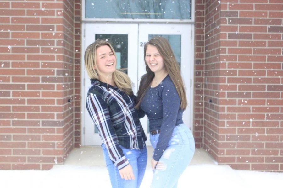 Seniors Carson Balman and Autumn Everhart giggle together in the blizzard. While the weather is harsh, the two hug together portraying their relationship. The two are laughing uncontrollably in the photo showing that they really have the most contagious laughs. 
