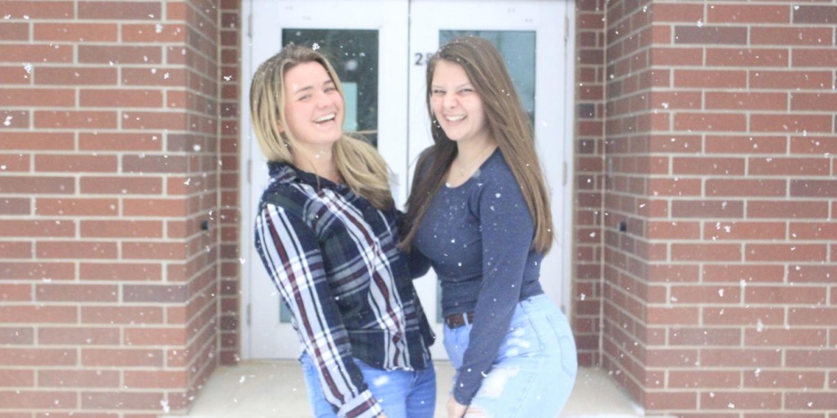 Seniors Carson Balman and Autumn Everhart giggle together in the blizzard. While the weather is harsh, the two hug together portraying their relationship. The two are laughing uncontrollably in the photo showing that they really have the most contagious laughs. 