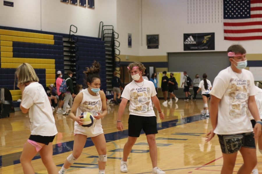 “B Team” laughs while  playing in their volleyball bracket at Wednesdays Co-Ed Volleyball game. B Team advanced all the way into the final four, winning against underclassmen and teachers alike. While this event had hiccups, it proved to be a great new homecoming tradition.