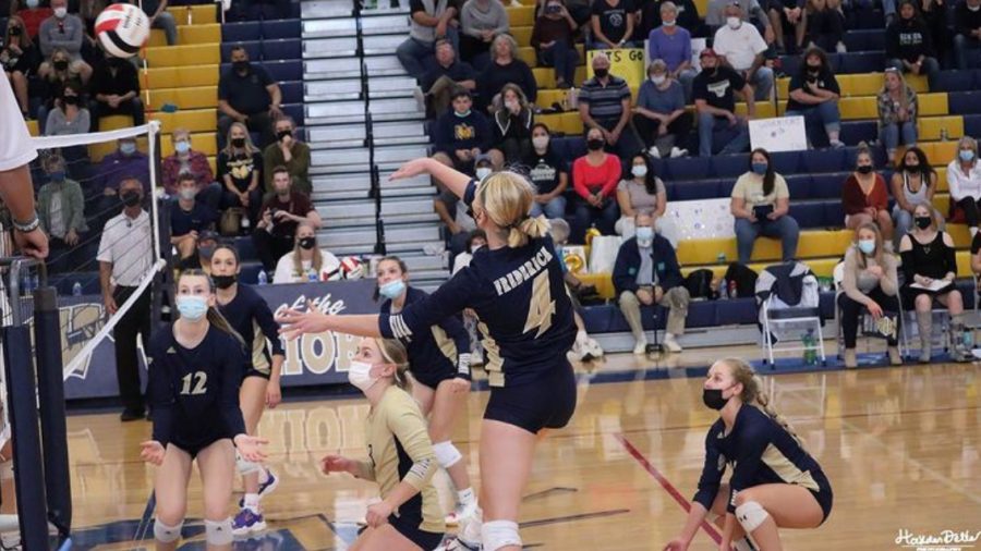 Kinley Lindhardt going up for a spike at Regionals.