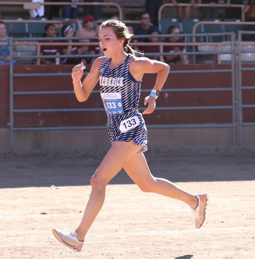 Mikenna Hoffman exceeds towards the finish line her Senior year.