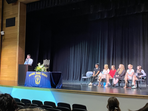 Frederick High Senior Quinn McNeill addresses the new members of National Honor Society at the latest induction ceremony. Tuesdays event was the first to take place in over two years due to the restrictions that COVID-19 brought to large events.
