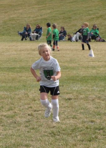 Tiny Kennedy playing soccer 