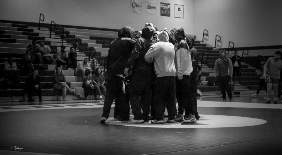 The wrestling team huddles on the mat before their home dual against Riverdale Ridge. With Frederick hosting regionals this year on February 10th, they are more than ever ready. Coach Anthony explains, “I think we will do very well. Were going to send a record number of athletes to state this year. Frederick is just on the cusp of making major statements. When a team believes in their community, their coaches, and themselves great things become possible.”