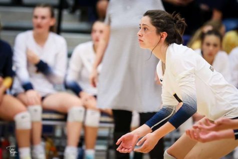 Kierstyn getting ready for the serve on the court at a home volleyball game. Kierstyn brought the sports section in the Lantern to the next level as she made sure to keep all scores and sporting events up to date. She is on the road to an intelligent and adventurous future. 