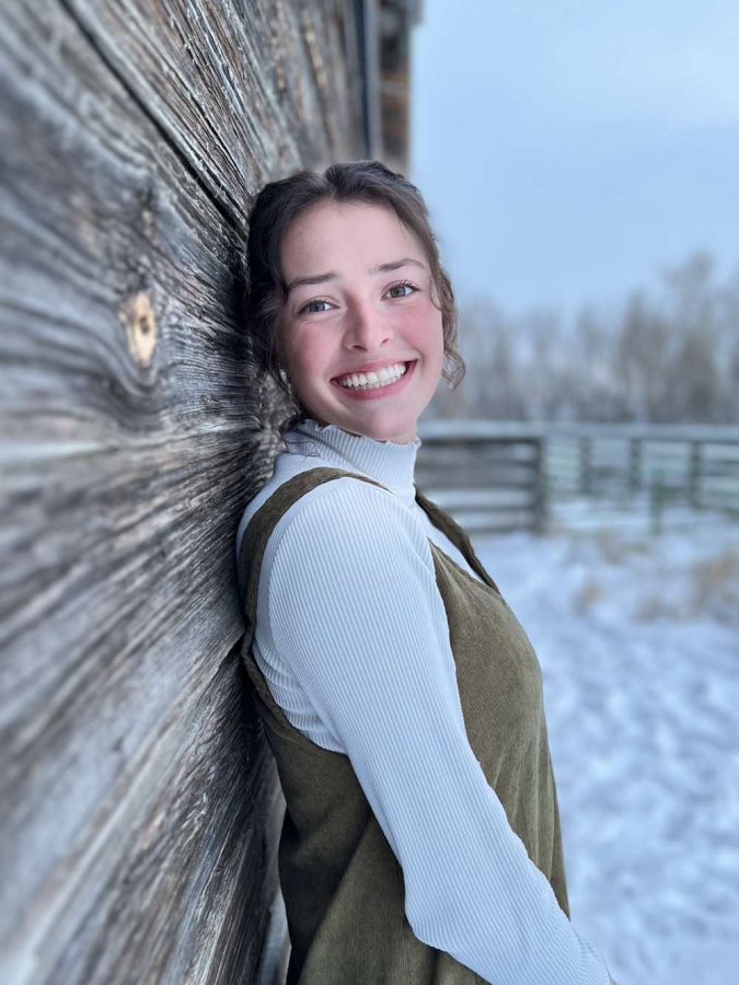 Ryley Anderson smiling at the camera for her senior photos in the beautiful white snow. Ryley was able to lead everyone in the journalism program to success. Ryley is going to have a strong future at UNC and they are lucky to have her.