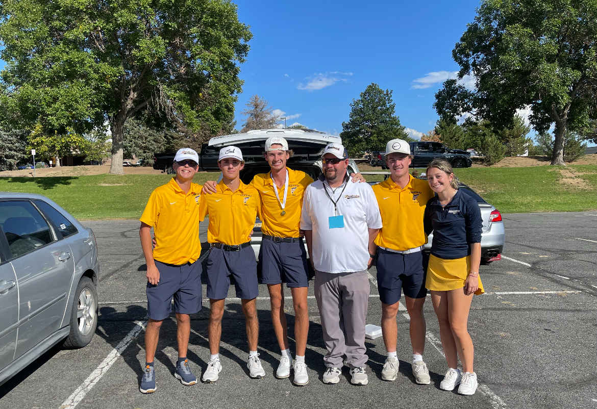 The Frederick Varsity Golf team smiles at the camera before their hard working playoffs. Overall the Frederick Golf team had a great season and they are happy with the outcome of the season.