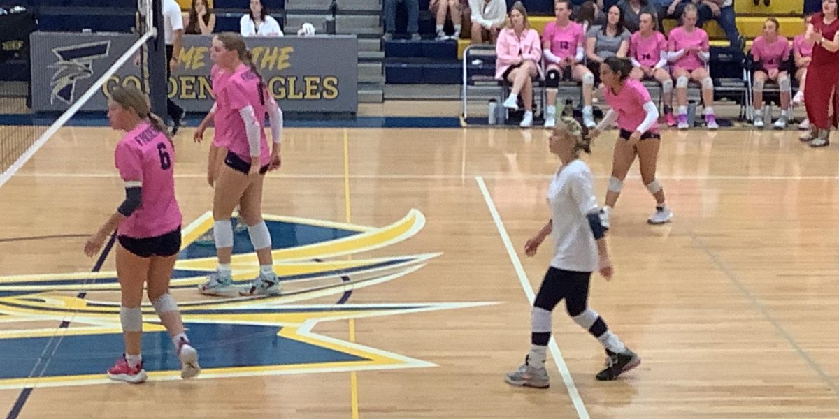 Sophomore Tatiana Staab prepares to receive a serve in the third set of Tuesdays varsity volleyball game. Despite a solid win over the first two sets, the Golden Eagles lost the next three sets, ending the night 2-3.