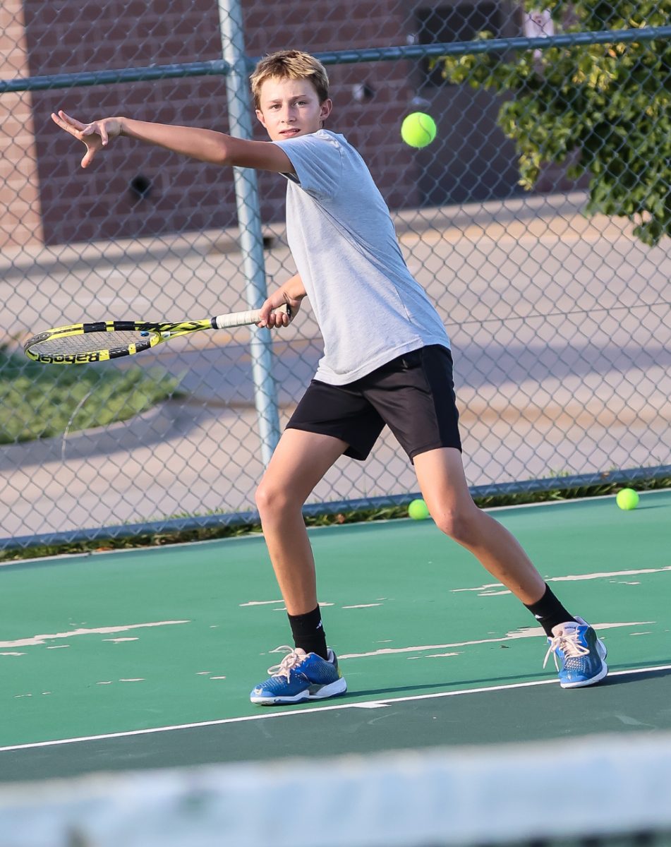 Sophomore Josiah Brittenham positioning himself to swing and hit the Tennis Ball. He’s been working extremely hard in practice. 