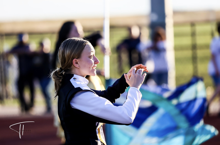 Lily conducting the marching band at a Frederick football game this year. Lily is one of the drum majors this year, alongside senior Braden Thomas. Being drum major has given her a lot of leadership experience.