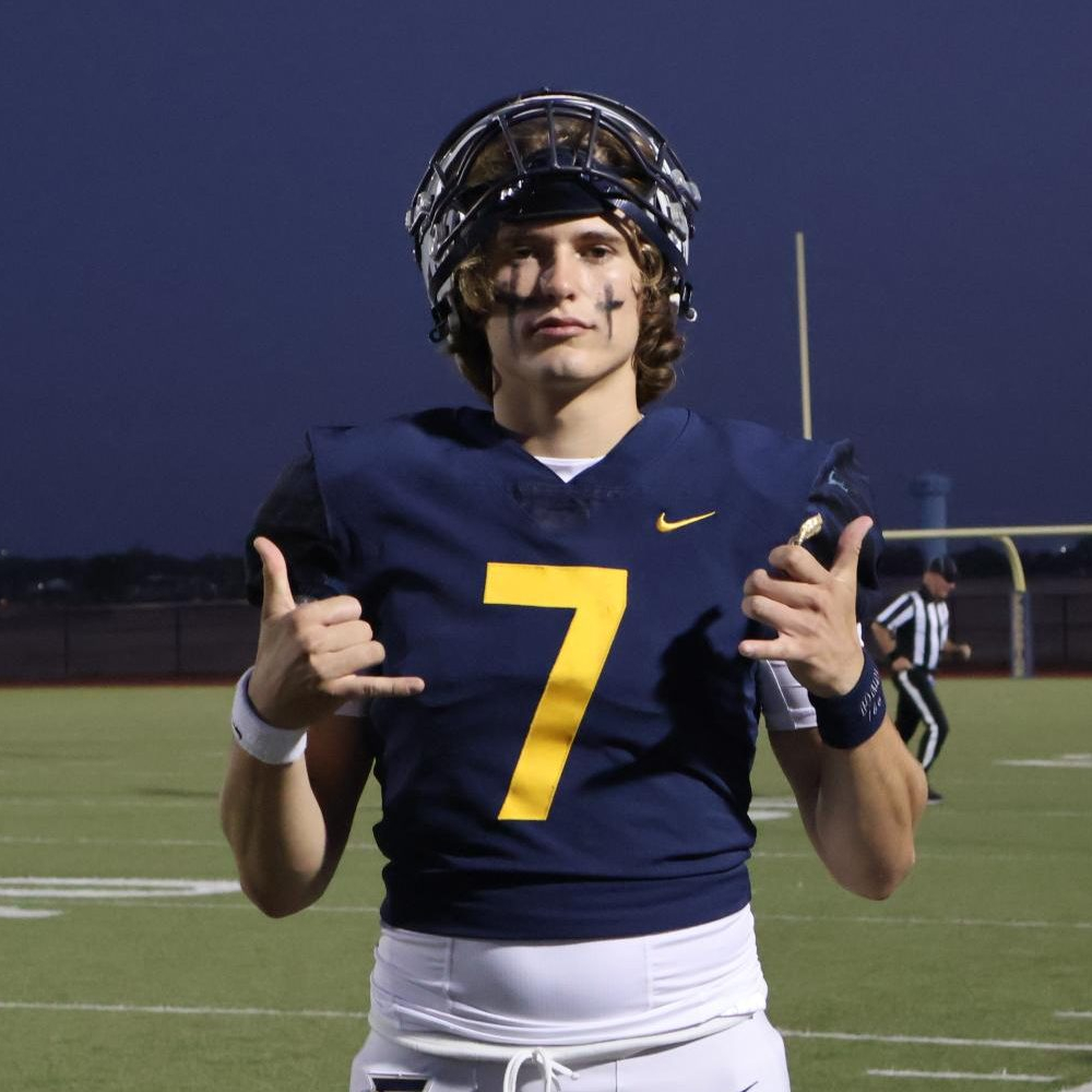 Frederick Football quarterback Gavin Ishmael tells the camera to hang loose after warming up before a home game.