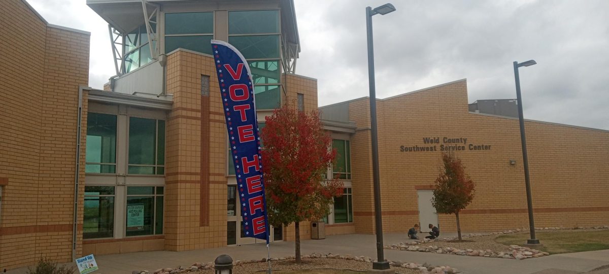 A voting banner waves in the wind outside the Weld County Services building in Del Camino, one of the nearest voting centers for the 2024 election. The Republican wave that swept the nation was just a splash in Colorado, as most progressive candidates won re-election and several progressive policies around abortion, same-sex marriage, and excise taxes on firearms passed.