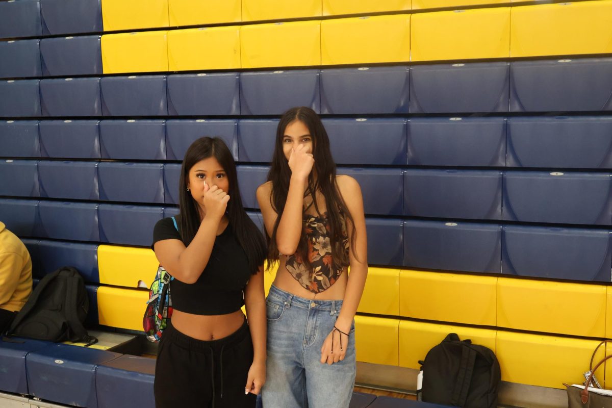 Junior Doris Lian and sophomore Leigh Tilton hold their noses in the gym. With sweating bodies playing sports, the gym should be the stinkiest place at Frederick High, but the sad truth is that dishonor belongs to the large freshmen classes. With some teachers needing to open their windows to let out the freshman funk after class, it's time the class of 2028 to grow up and stop the stink.