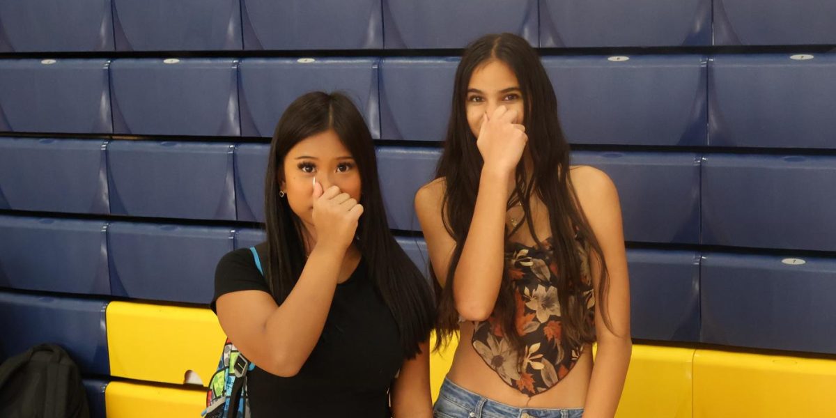 Junior Doris Lian and sophomore Leigh Tilton hold their noses in the gym. With sweating bodies playing sports, the gym should be the stinkiest place at Frederick High, but the sad truth is that dishonor belongs to the large freshmen classes. With some teachers needing to open their windows to let out the freshman funk after class, it's time the class of 2028 to grow up and stop the stink.