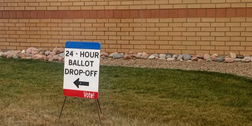 A voting sign outside of the Southwest Weld Motor Vehicle Office in Del Camino. This location has a permanent ballot drop box, in-person early voting starting 15 days before the election, and in-person voter registration any time.