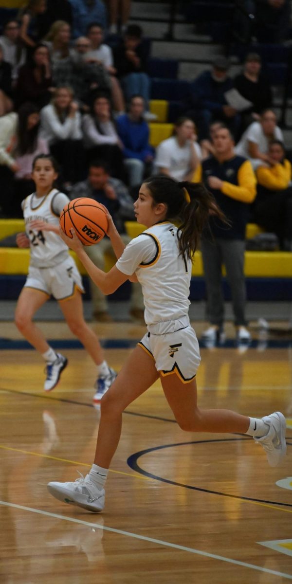 Sophomore Peiton Stone takes the ball down the court with her senior teammate Ryless Gallegos close behind. Communication is key in basketball, and all of the team’s preseason work really paid off in that regard. The team was able to complete a majority of their passes which led to more points being scored. 