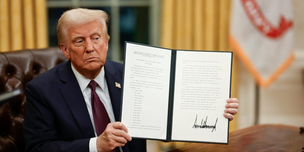 Donald Trump displays one of the 42 executive orders he signed immediately following his innauguration as president on January 20, 2025. This included EO 14168, a broad mandate ordering the US government to rescind protections for and deny recognition of transgender Americans. (Trump White House, public domain)