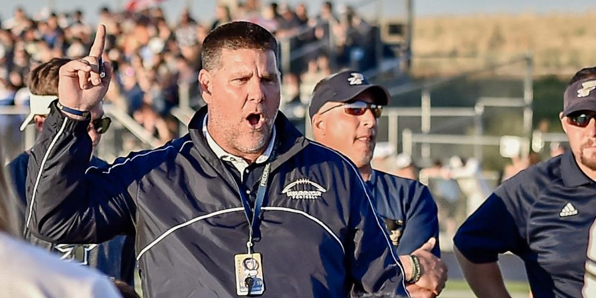 Coach Peeples instructs his team during an intense game. Peeples, who took Frederick football from rock bottom to prosperity, will be resigning as head coach. (Courtesy of Steve Oathout)