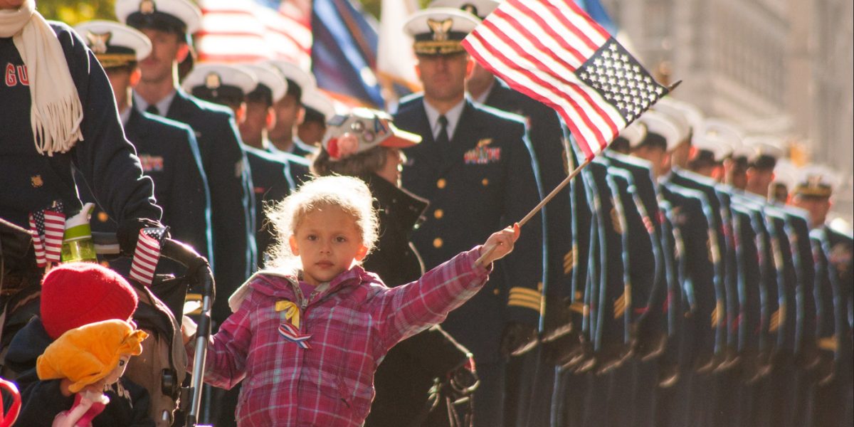 A child of a New York area Coast Guard service member waves the American Flag while marching in New York City's Veterans Day Parade, Nov. 11, 2013. The Parade honors all eras and branches of military service, with special recognition given this year to the history of American Women in Uniform. (U.S. Coast Guard photo by Seaman Robert Harclerode)
Date Taken:11.11.2013