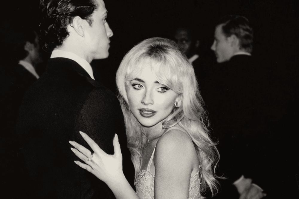 Sabrina Carpenter dances with a stoic partner on one of several covers for her new album Man's Best Friend. Her initial cover art featured Carpenter on all fours in front of a standing man who is pulling her hair in his fist, which many have decried as overly sexual and anti-female. This cover premiered in a June 29 Instagram post by Carpenter, who joked that it was "approved by God." (Island Records)
