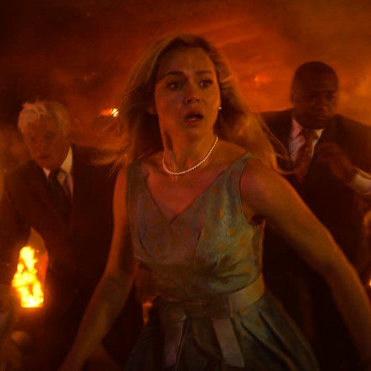 Iris (Brec Bassinger) searches for a way out of the crumbling Sky View Restaurant in a premonition. (Warner Bros./New Line Cinema)
