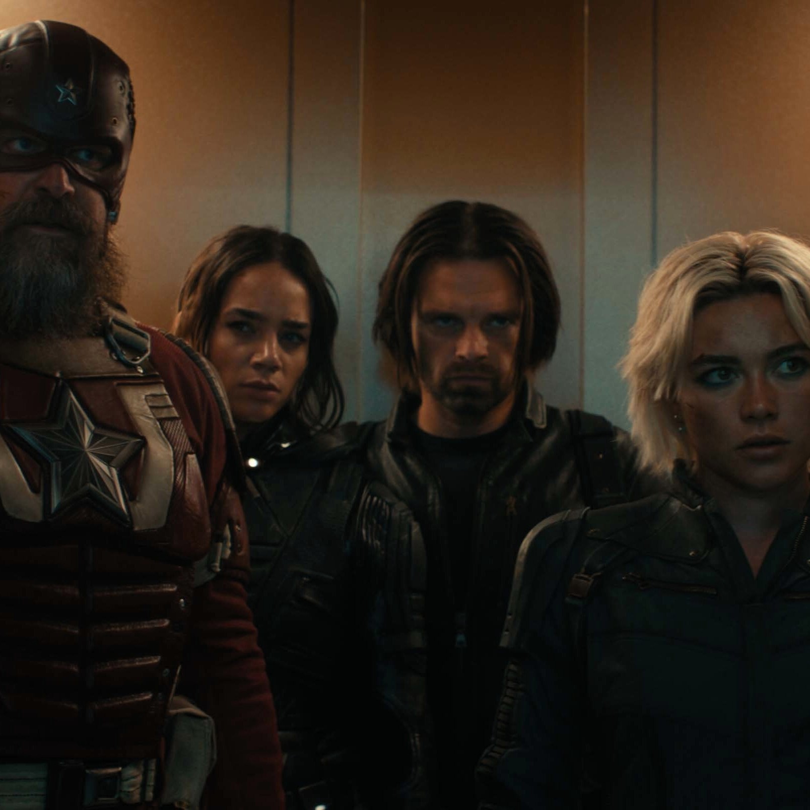 Red Guardian (David Harbour), Ghost (Hannah John-Kamen), the Winter Soldier (Sebastian Stan), and White Widow (Florence Pugh) infiltrate a high-security facility. (Disney/Marvel Studios)