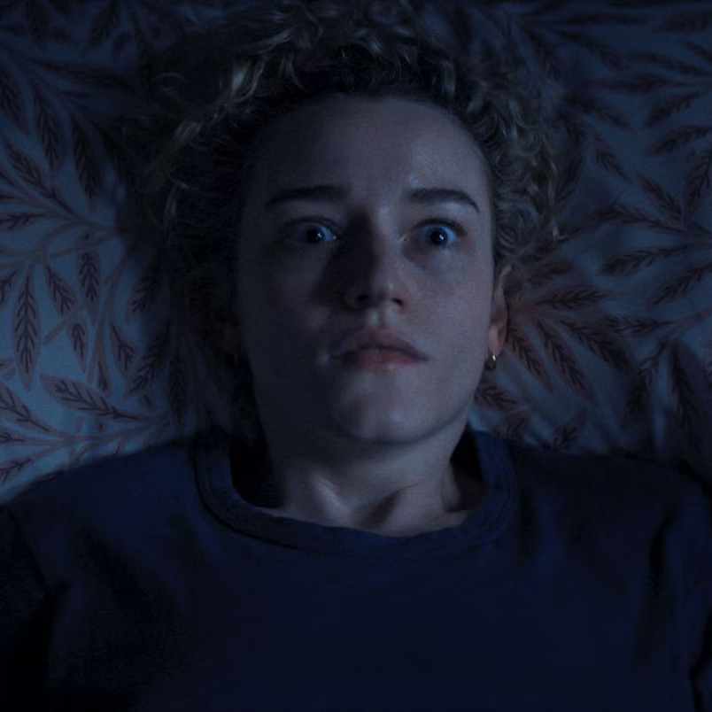 Fourth-grade teacher Justine (Julia Gardner) has frightening night visions after almost all of her students disappear. (Warner Bros./New Line Cinema)