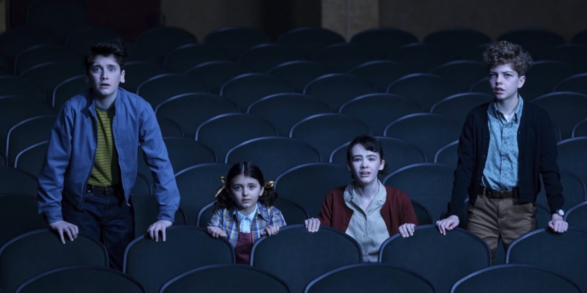 In the first episode of It: Welcome to Derry, a group of kids venture to the Capitol movie theater, the last place their friend Matty was seen before he disappeared. However, they get more than they bargained for when they encounter the cosmic monster known as It. From left to right: Sci-fi conspiracy theorist Phil Malkin (Jack Molloy Legault), his little sister Susie (played by Legault's real-life sister Matilda), series protagonist "Loony" Lilly Bainbridge (Clara Stack), and comic-loving Teddy Uris (Mikkal Karim-Fidler). It: Welcome to Derry has a strong start and promises to be one of the horror highlights of the year. (Brooke Palmer/HBO)